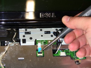 The power button board is glued down so it will need to be pried up with a flat head screw driver. 