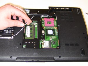 Remove the (2) 2.5mm x 5mm hinge screws from the base of the laptop. 