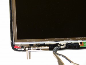 Unscrew (1) 2.5mm x 5mm screws holding the right LCD rail to the base.