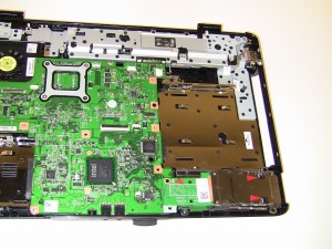 Lift the Express Card Slot up to remove it off of the motherboard. 