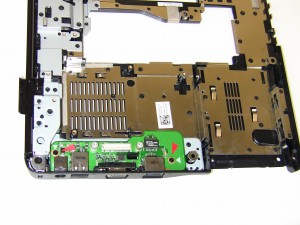 Unscrew the (2) 2.5mm x 5mm retaining screws form the 1545 DC Power Jack / USB IO Circuit Board and pull the board out of the base assembly. 