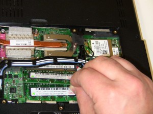 Gently pull the 1525/1526 memory stick out of the memory slot. 