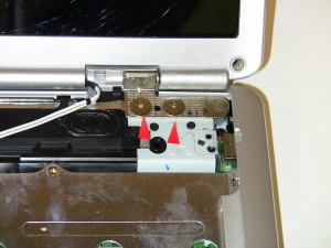 Unscrew the (2) 2.5mm x 3mm – 10 mm wafer hinge screws from the left display hinge. 