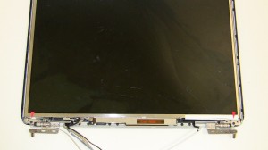 Remove the (2) 2.5mm x 5mm screws that attach the LCD mounting rails to the hinges. 