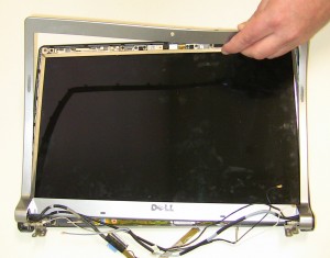 Lift the bezel away from the display assembly. 