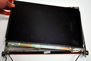 Pull the LCD Cable out of the cable channels on the LCD back cover assembly. 