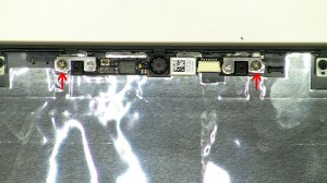 Remove the web camera from the LCD back cover assembly. 