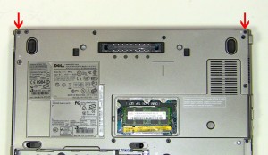 Remove the (2) 2.5mm x 5mm hinge screws on the back edge of the laptop. 