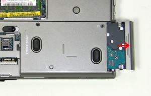 Remove the (2) 3mm x 3mm hard drive screws. 