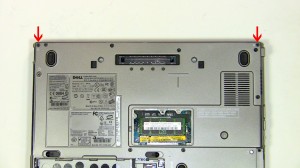 Unscrew the (2) 2.5mm x 5mm hinge screws on the back edge of the laptop. 