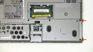 Loosen the 2 non-removable PCI slot screws. 