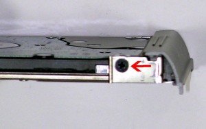 Unscrew the 3mm x 3mm hard drive caddy screw and remove the caddy. 