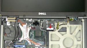 Remove the antenna cables and LCD cable from the routing channels. 