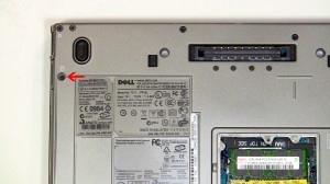 Eject the optical drive latch by pressing it in. 