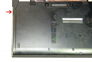 Pull the optical drive latch to slide the drive out of the laptop. 