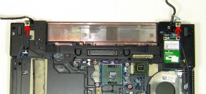 Turn the laptop over, open the LCD, and lift it off of the base. 