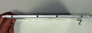 Remove the (8) 2mm x 3mm screw holding the mounting rail brackets to the left and right side of the LCD screen. 