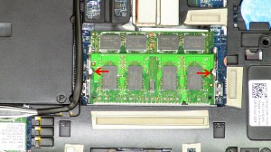 Separate the clips on the left and right side of the memory stick until the memory pivots up to a 45 degree angle.