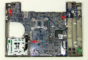 Carefully lift the motherboard out of the base, starting at the back. The USB/NIC circuit board will disconnect from the motherboard and stay in the base assembly.