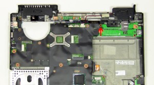 Remove the (2) 2.5mm x 5mm screws. Carefully lift the motherboard up by the right side I/O board to unplug it.