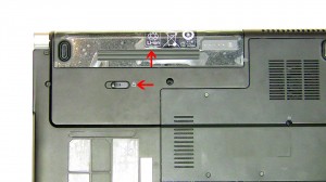 Slide the latch to the left and slide the battery out of the laptop.