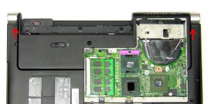 Remove the (2) 2.5mm x 5mm hinge screws on the bottom of the laptop. 