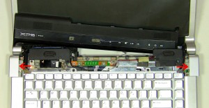 Lift the hinge covers off of the laptop. 