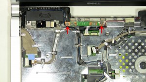 Lift the power button board away from the laptop base.