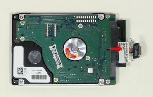 Remove the hard drive caddy and slide the hard drive adapter off of the SATA hard drive.