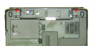 Remove the (2) 2.5mm x 8mm hinge screws on the bottom of the laptop. 