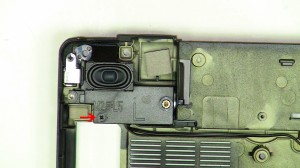 Remove the 2.5mm x 5mm Left speaker screw. 