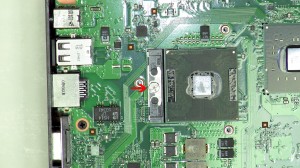 Turn the CPU locking screw counterclockwise until the CPU is loose. 