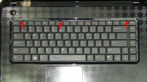 Using a scribe or a flat head screw driver, press in the 3 latches that allow the keyboard to lift up. 