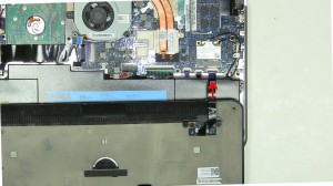 Carefully lift the base cover off of laptop and unplug the battery indicator cable. 