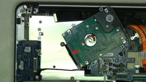 Remove the 4 hard drive caddy screws.