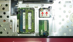 Remove the retaining screw and lift the wireless card out of the slot. 