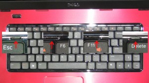 Press in the 4 keyboard clips to loosen the keyboard.