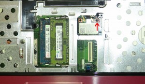 Remove the retaining screw and lift the wireless card out of the slot.