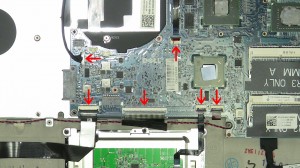 Carefully lift the motherboard away from the laptop and turn it over.