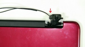 Loosen the LCD Cable from the routing channels on the left hinge.