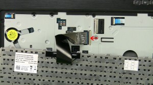 Using a small flathead screwdriver, press in the 4 keyboard latches and lift the keyboard up.