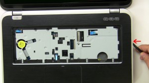 Using a scribe or a flathead screwdriver, separate the palmrest from the laptop base.