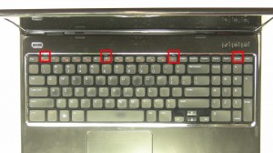 Press in the 4 keyboard clips to loosen the keyboard.