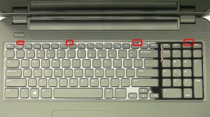 Using a small flat heat screwdriver or a plastic scribe, pry the keyboard from the tabs on the palmrest.