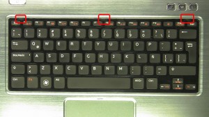 Press the keyboard latches in and turn the keyboard over.