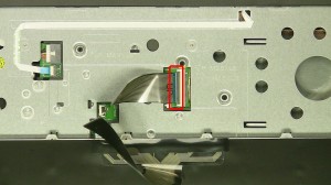 Using a small flat head screwdriver, press in the keyboard latches and carefully remove and turn over the keyboard.