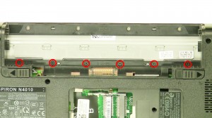 Remove the screws under the optical drive.