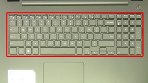 Press in the keyboard latches and loosen the keyboard.