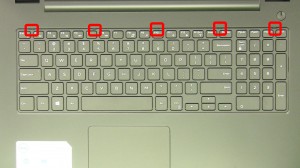 Press in the keyboard latches and loosen the keyboard.