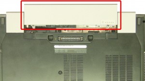 Slide the latches over and slide the battery out of the laptop.